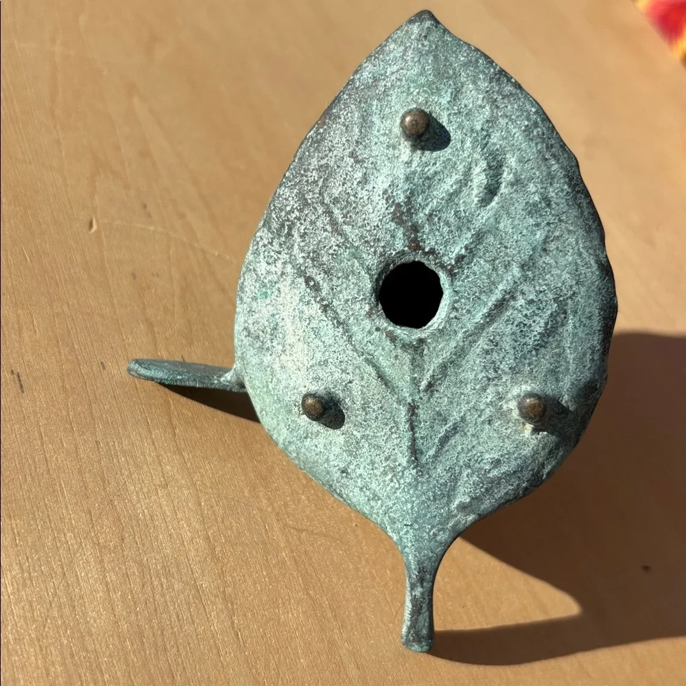 Vintage Bronze Rabbit Paddling A Leaf Boat